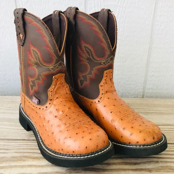 Men's western boots with a concho - studded strap and a pointed toeL9900 Justin Gypsy Cognac Ostrich Print