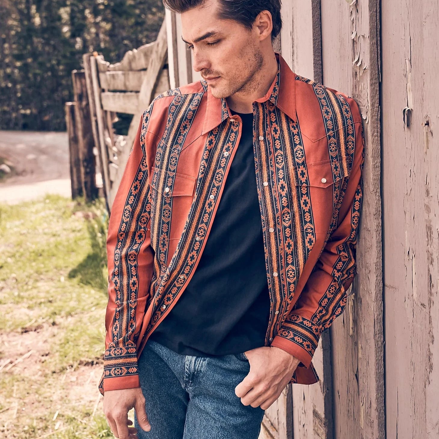 Men's western boots with a decorative concho belt and buckleWrangler Men's Checotah L/S Western Snap Shirt in Rusty Orange